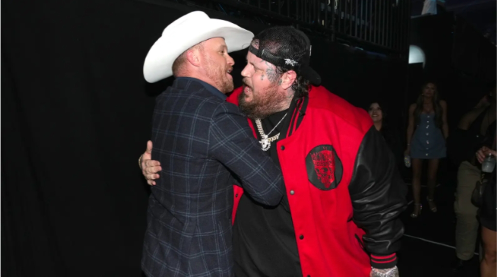 Cody Johnson and Jelly Roll hugging each other