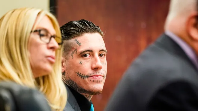 Wade Wilson with stitches tattoo on his face