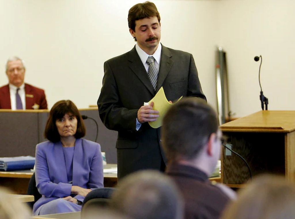 William Flynn in a court holding a yellow paper